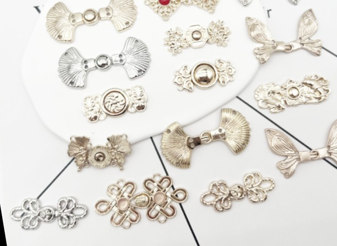 A collection of ornate metal clasps