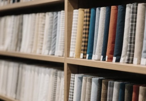 Shelves filled with colorful fabric rolls