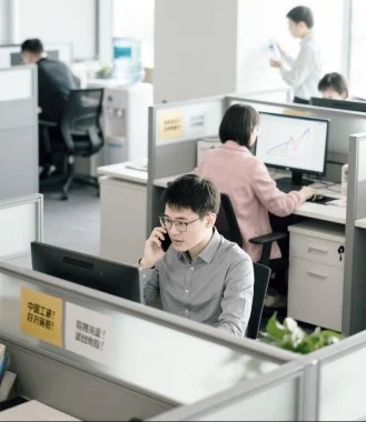 Employees working in a modern office setting.