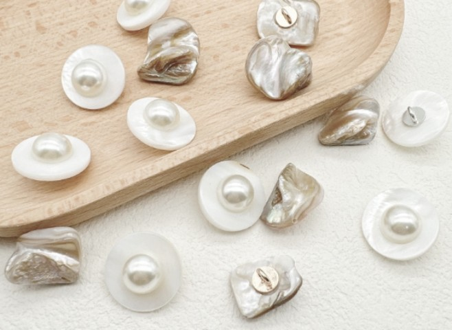A collection of pearl and shell buttons