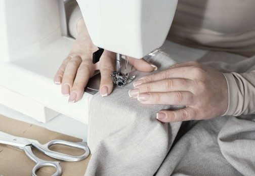 Person using a sewing machine