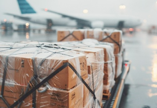 Cargo boxes being loaded onto airplane