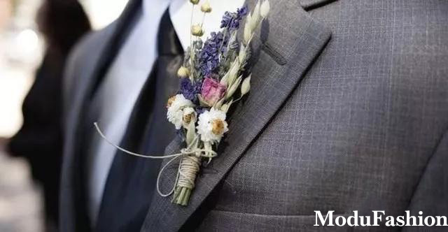 Custom apparel | Gray suit featuring a colorful boutonniere