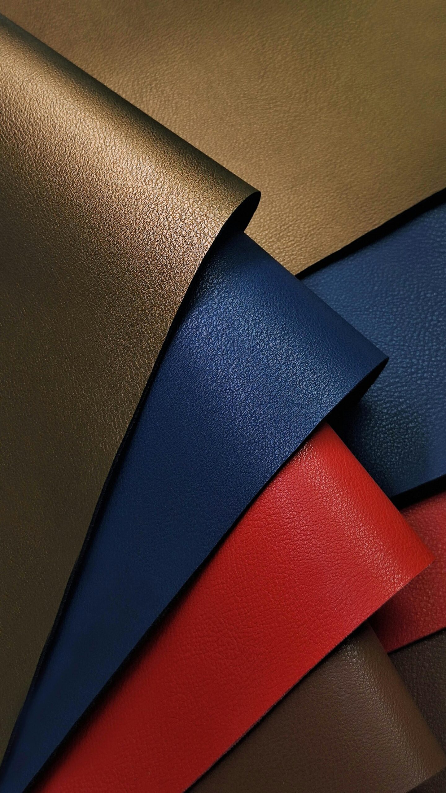 Stack of Colorful Synthetic Leather Fabrics Photo by Edgar Martínez