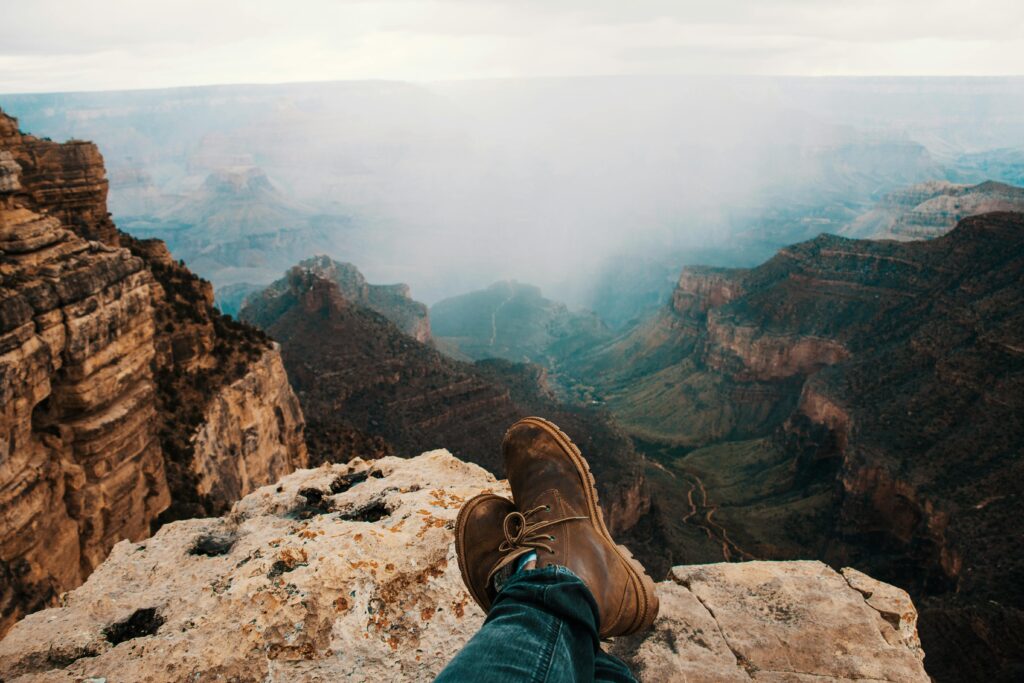 A man wear Nubuck Shoes in cliff