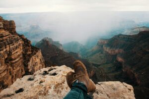 A man wear Nubuck Shoes in cliff