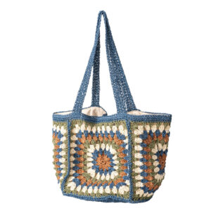 Denim-blue handmade crochet granny-square straw tote bag, front view