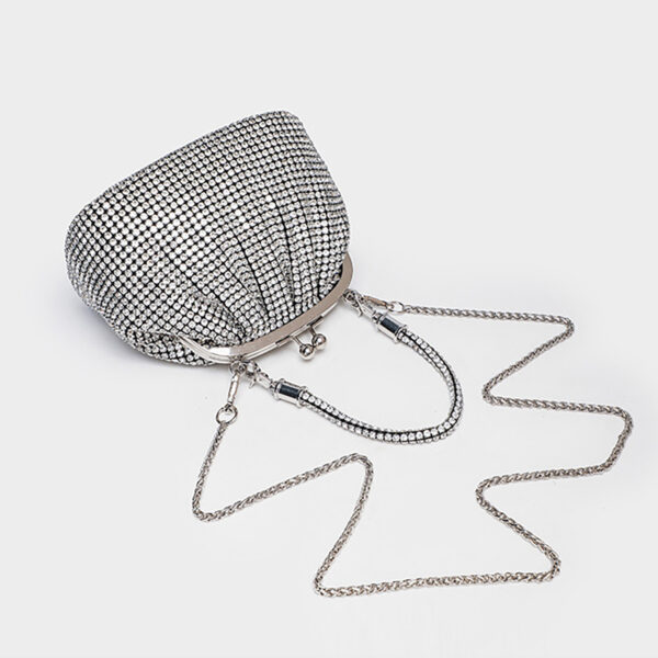 Silver rhinestone bag with detachable crossbody chain laid out