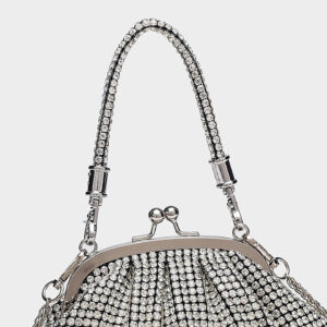 Detail of rhinestone handle and hardware on evening purse