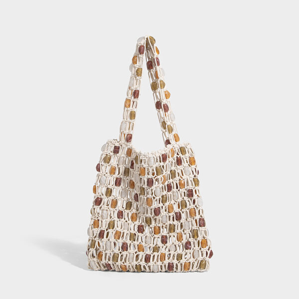 Beaded net shoulder bag, angled front on light background