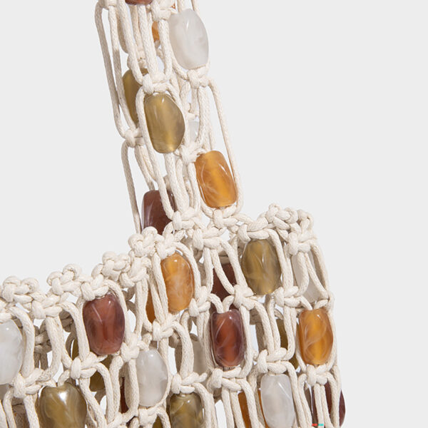 Close-up of beads and woven net detail on PU cord tote