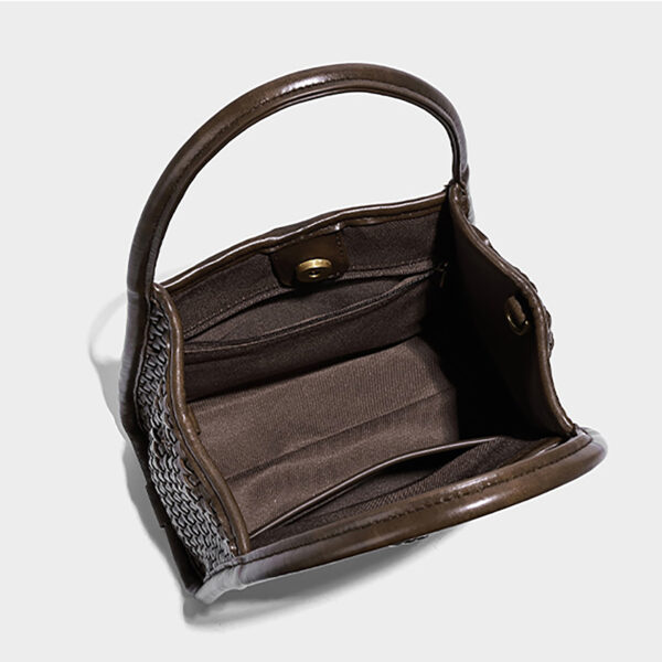Interior view showing polyester lining and inner zipper pocket of bucket tote