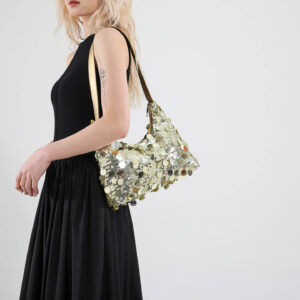 Model side view with gold sequin crossbody/underarm bag