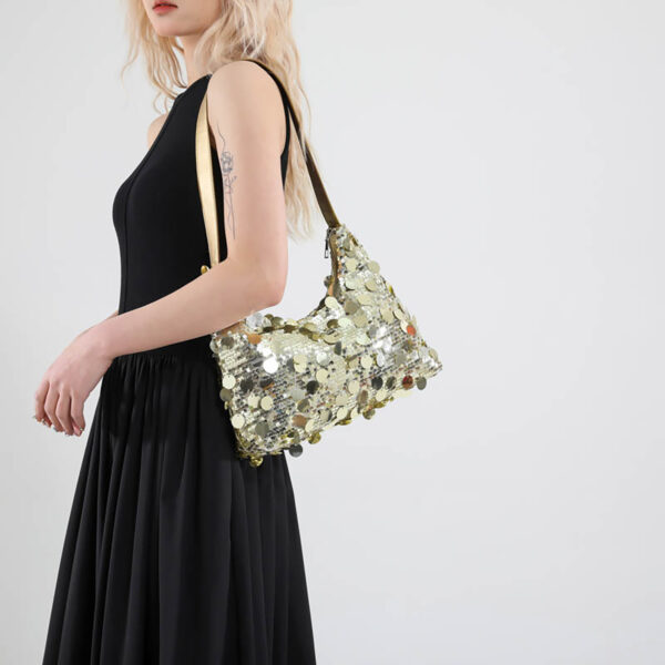 Model side view with gold sequin crossbody/underarm bag
