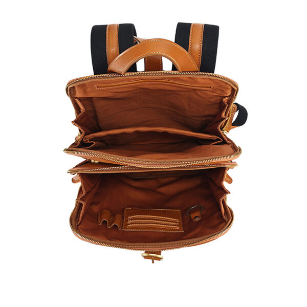 Inside view showing laptop sleeve, zipper compartment, and card/phone pockets