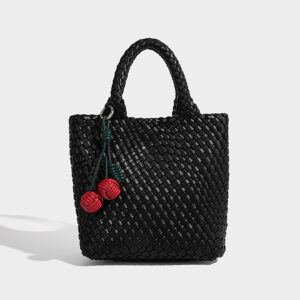 Black woven tote bag in PU with decorative knots, front view