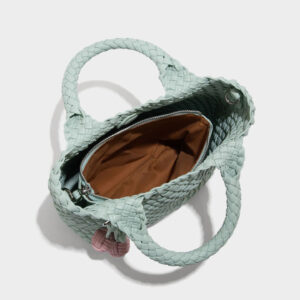 Interior view of mint woven tote showing cotton lining and zipper compartment