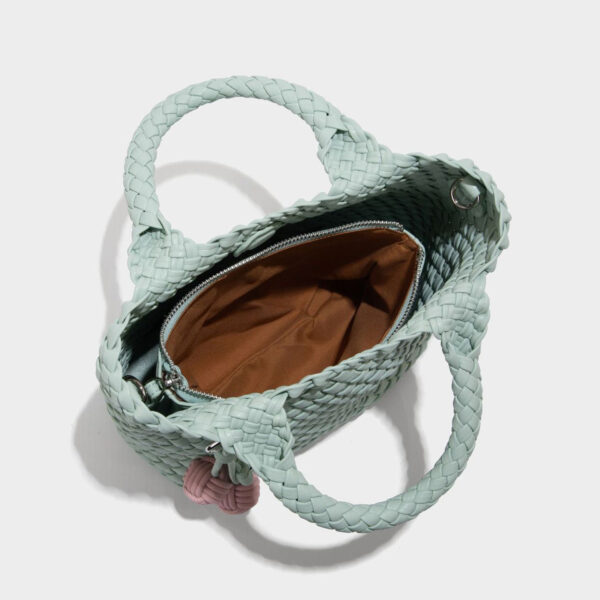 Interior view of mint woven tote showing cotton lining and zipper compartment