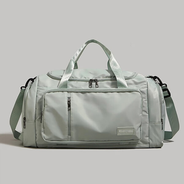 Mint sport duffel bag showing front zipper pockets