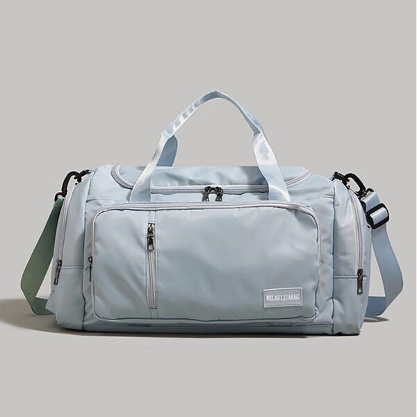 Light-blue swim bag / sport duffel, front pockets detail