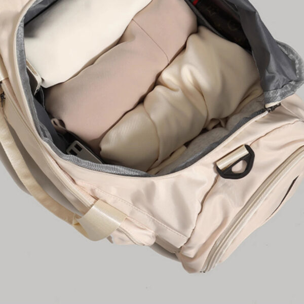 Interior view of duffle showing spacious main compartment for clothing