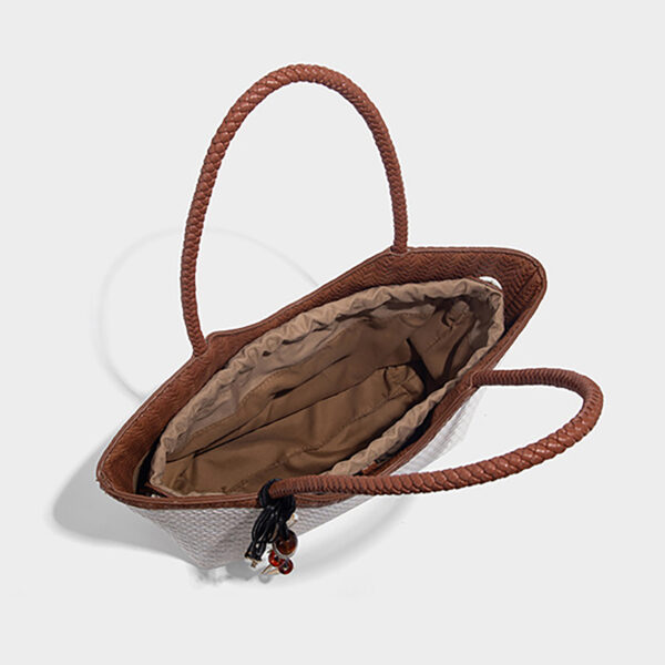 Top view of PU woven basket bag showing inner phone pocket