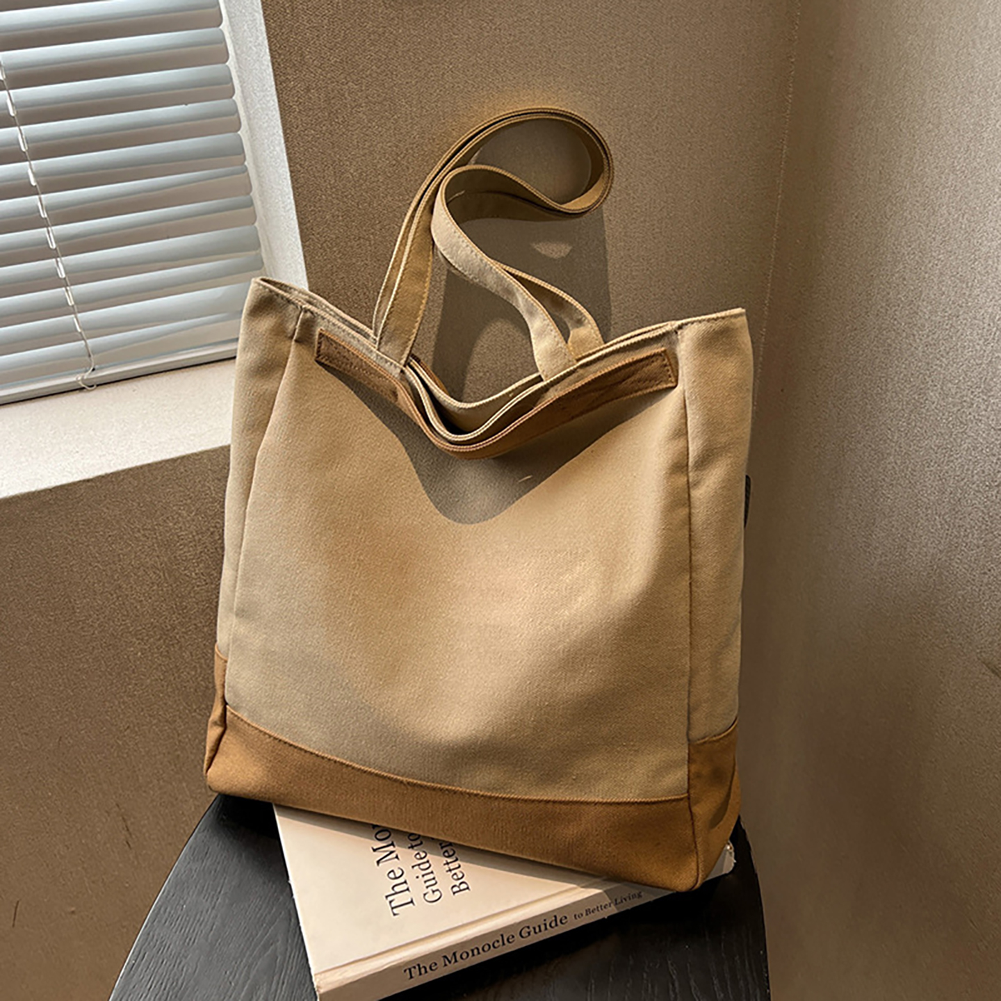 Khaki canvas tote bag with contrast bottom—tabletop view