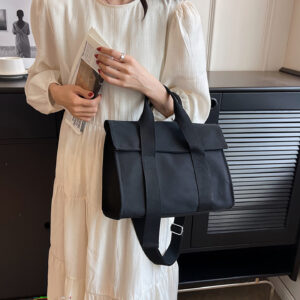 black canvas tote bag carry by model