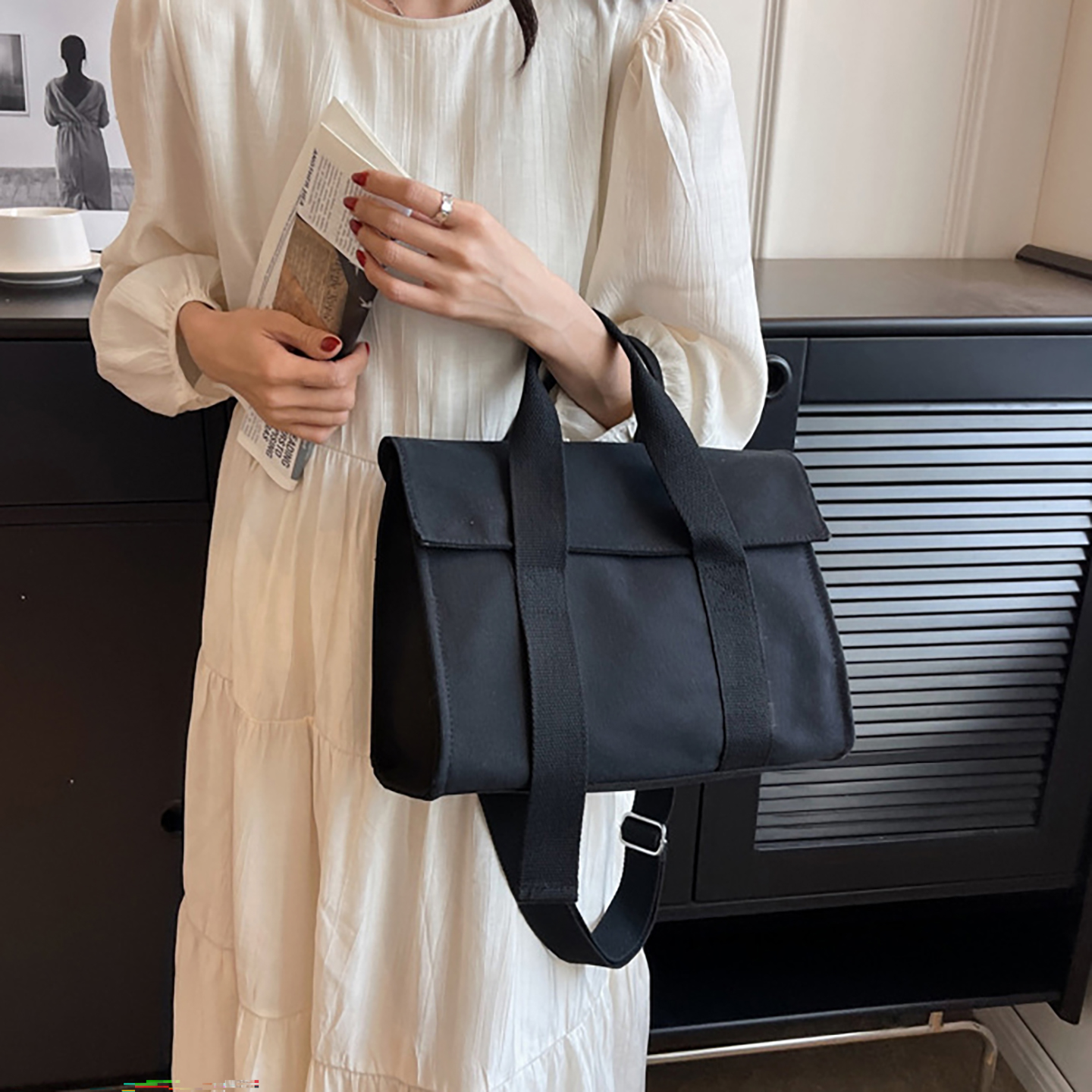 black canvas tote bag carry by model