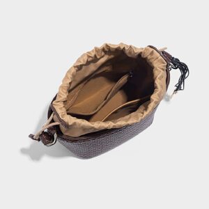 Interior top view of bucket bag showing drawstring pouch and pocketing.