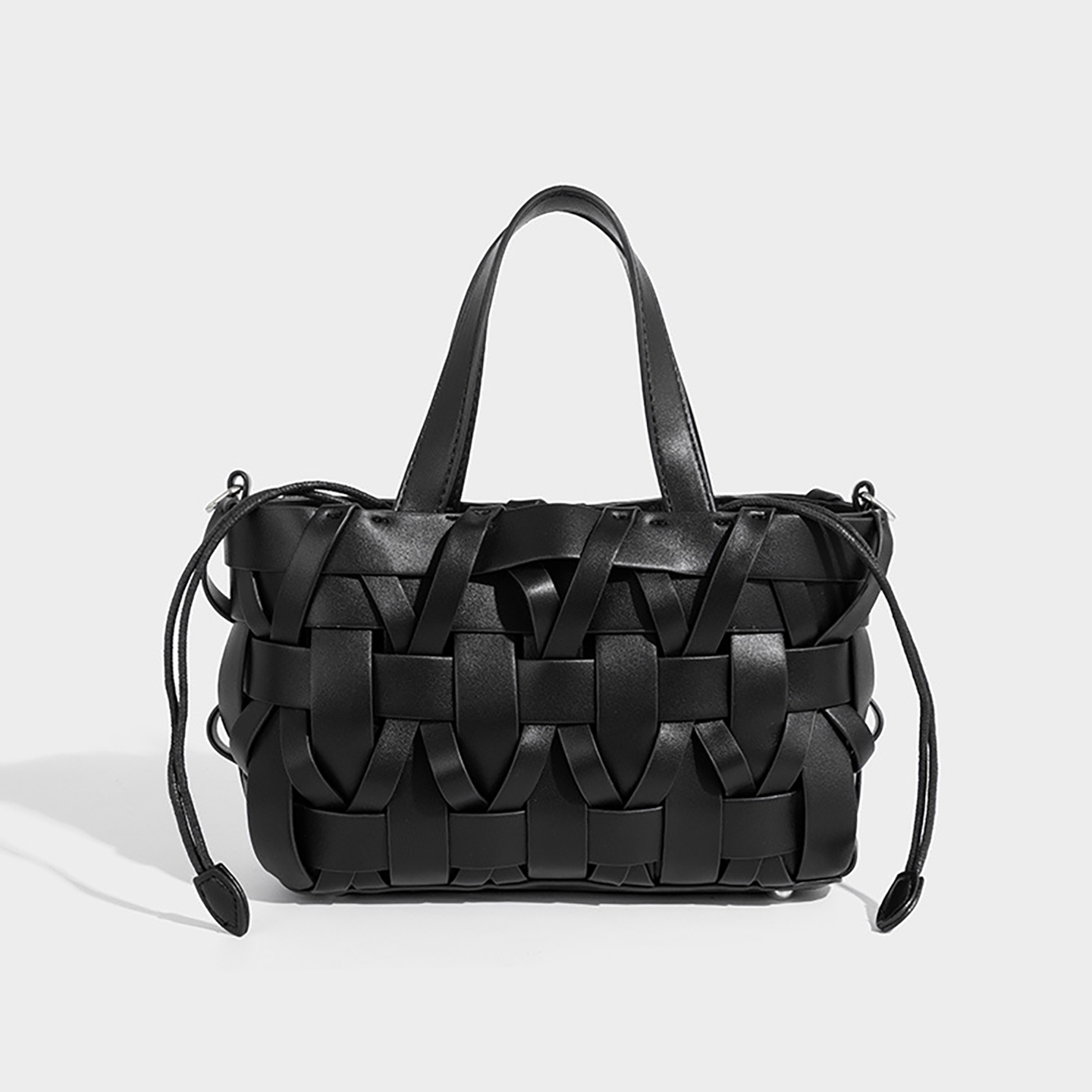 Black premium PU woven bucket bag for women with urban minimalist style