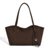 Front view of brown slouchy suede tote bag with heart charm and dual straps