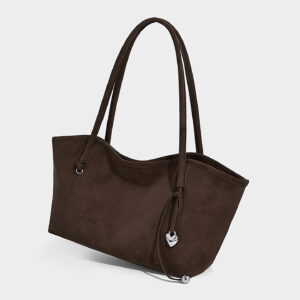 Side view of brown suede tote bag showing wavy edge and texture