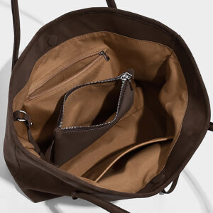 Interior view of suede tote bag with zipper pocket and polyester lining