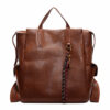 Front view of wholesale leather backpack in brown PU with tassel charm