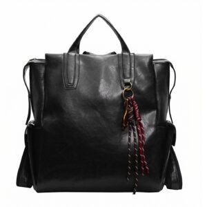 Front view of women's leather backpack in black with keychain tassel