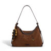 Front view of wholesale suede shoulder bag in brown with bead tassel