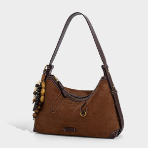 Side angle of custom suede purse in brown with D-ring accent