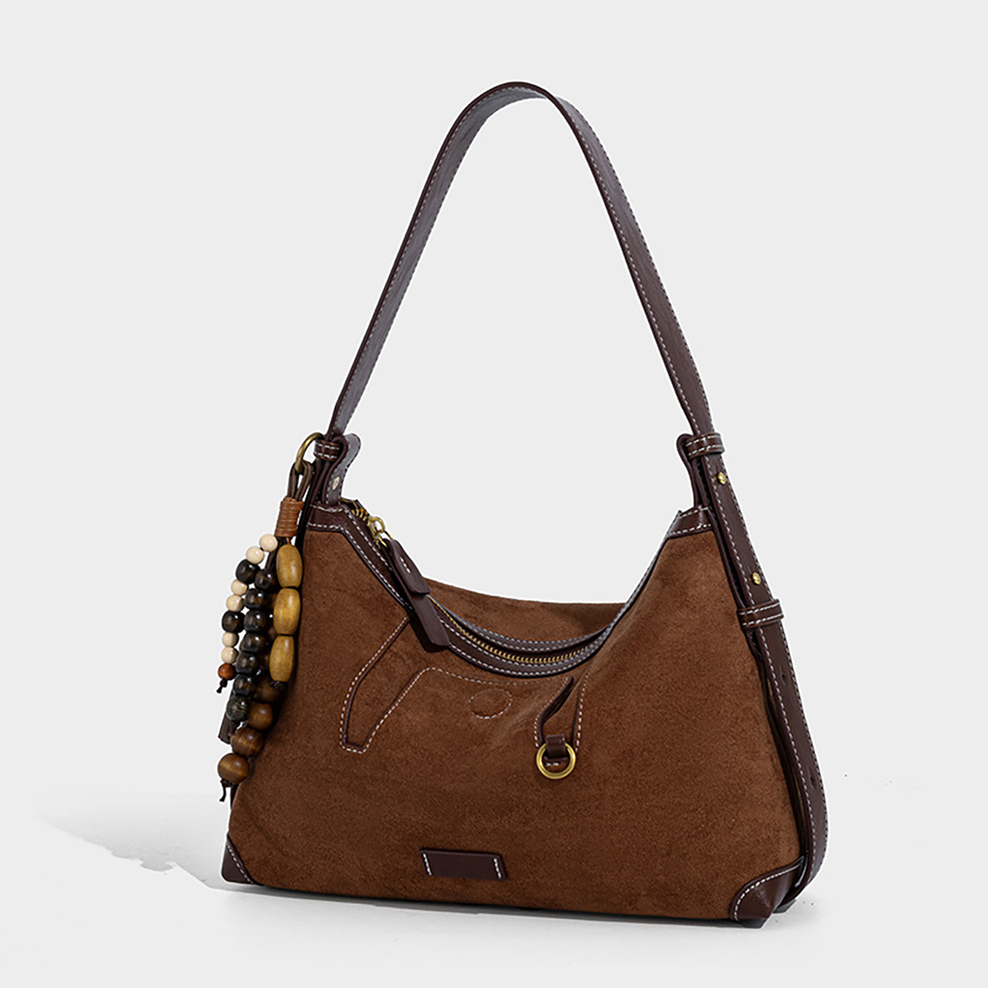 Side angle of custom suede purse in brown with D-ring accent