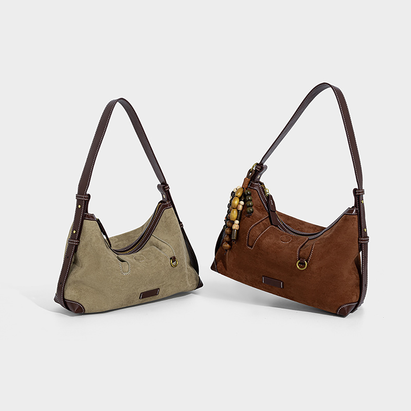 Pair of suede shoulder bags in khaki and brown for comparison