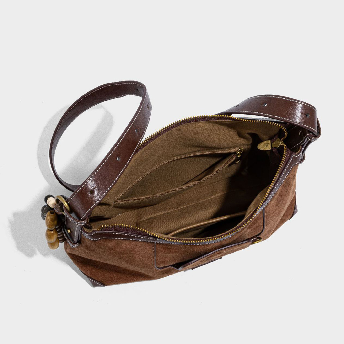 Open interior of boho hobo purse showing polyester lining and pockets