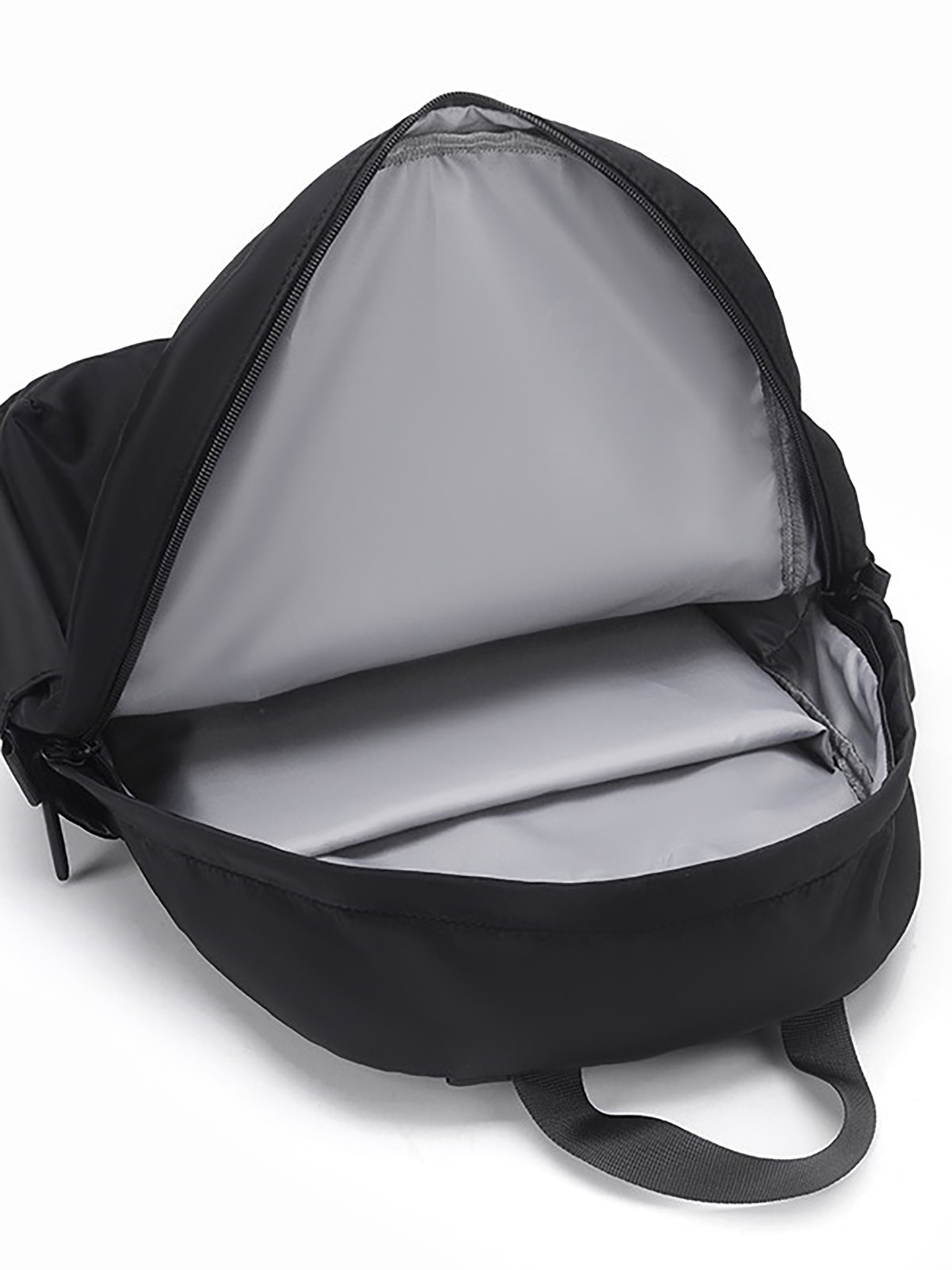 Inside view of polyester student backpack showing laptop sleeve