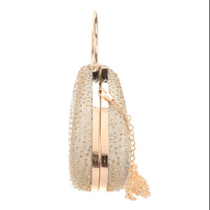 Side profile of round rhinestone purse with gold hardware and chain