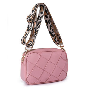 Pink woven women’s shoulder handbag with patterned strap, three-quarter view