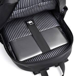 Open interior of black polyester backpack revealing padded 14-inch laptop compartment, organized pockets, and striped lining for secure storage.