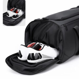 Open shoe compartment of men's gym duffel revealing ventilated design with space for sneakers, separated from main packing area.
