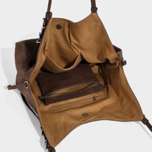 Open interior of PU hobo bag, revealing zipper pocket, slip pocket, and snap closure for organization
