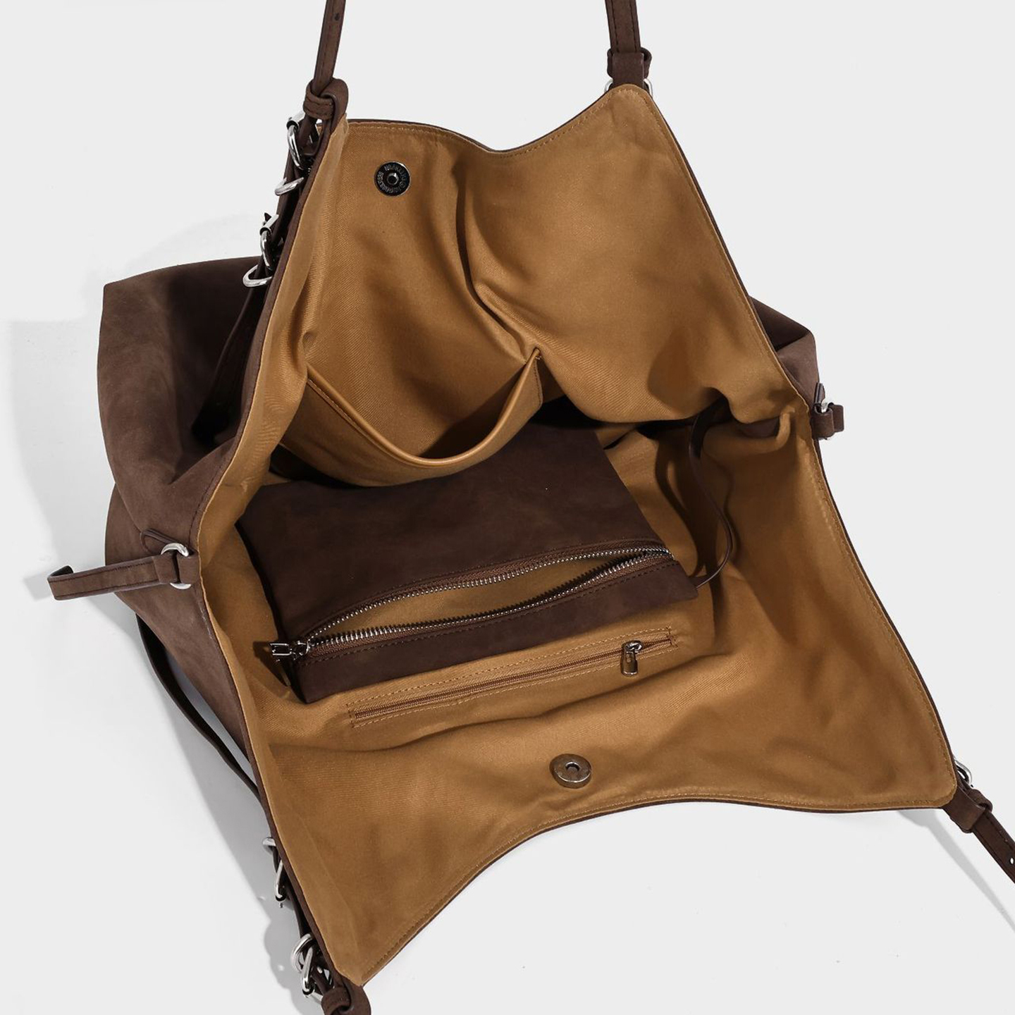 Open interior of PU hobo bag, revealing zipper pocket, slip pocket, and snap closure for organization