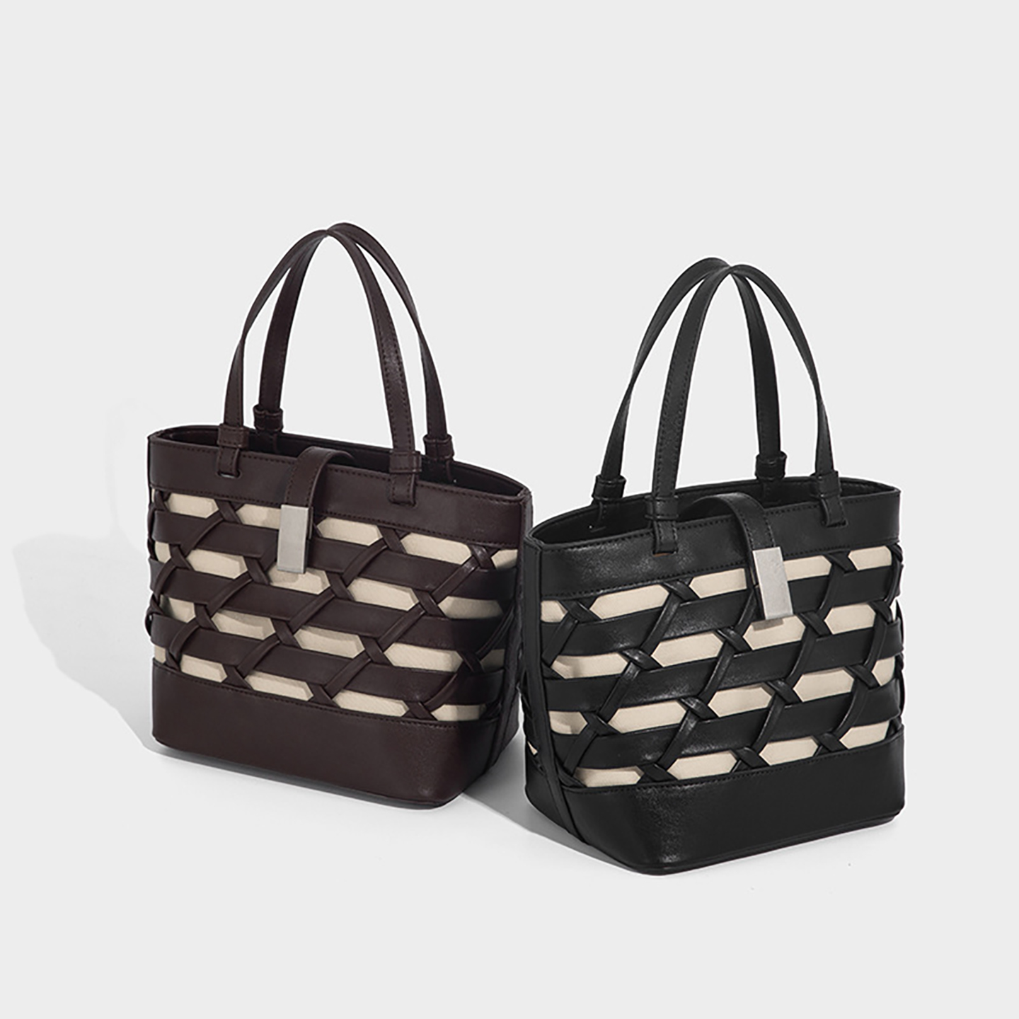 Black and coffee color options of the woven leather bucket bag side by side.