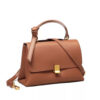 Camel vegan leather shoulder bag with top handle and crossbody strap, magnetic-snap flap.